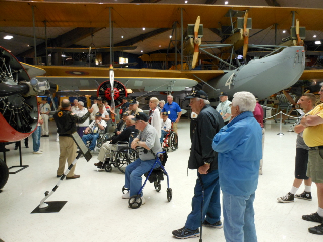 Welcome to the National Naval Aviation Museum and our tour guide Ron with the NC-4 in the background