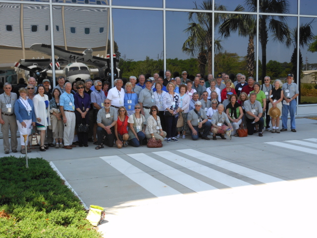 VS 31 Reunion attendees with the reflection of the S2 and the National Flight Academy